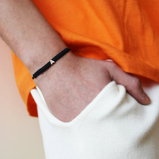 BRACCIALE TESSUTO NERO CON LETTERA ORO - Tangredi Gioielleria